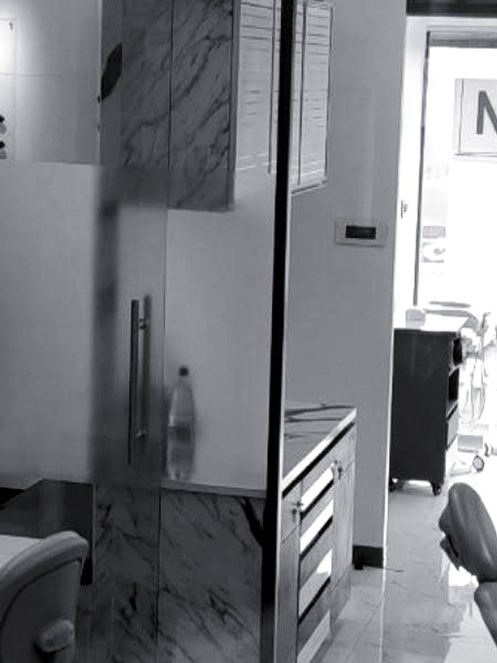 A treatment chair beside a window.