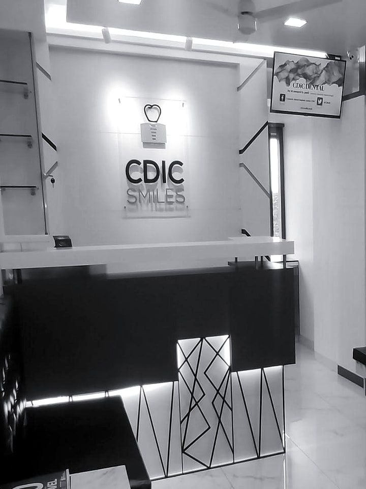 The reception desk under the CDIC Smiles logo.